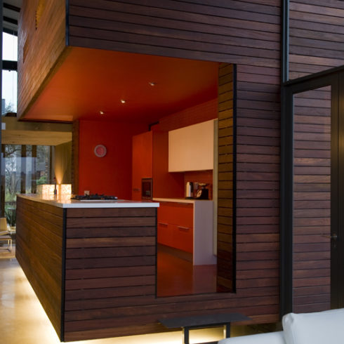 Floating kitchen cladded with hardwood decking fixed to a steel frame with EasyClips