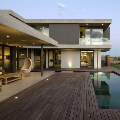 Hardwood deck installed with EasyClips around swimming pool by PTC Construction